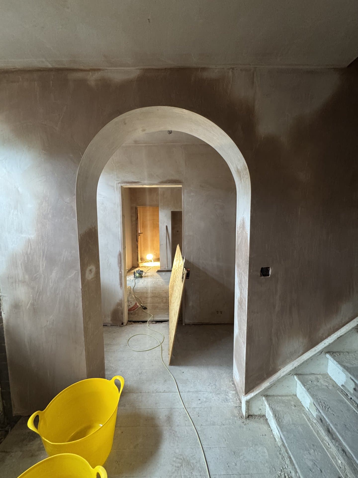 Hand-formed plastered archway with smooth-finish skim ready for paint